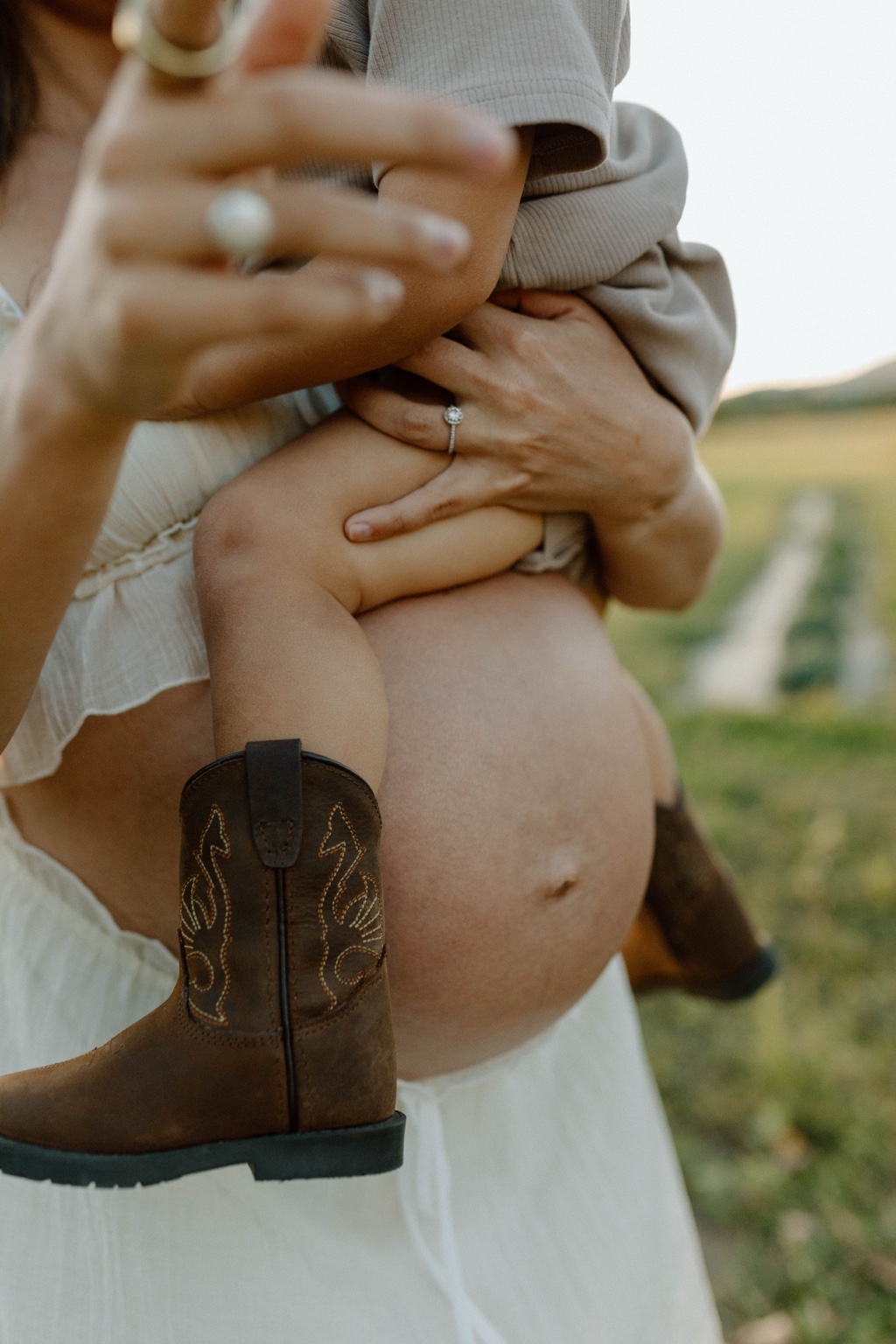 Expectant parent resting a hand on their pregnant belly